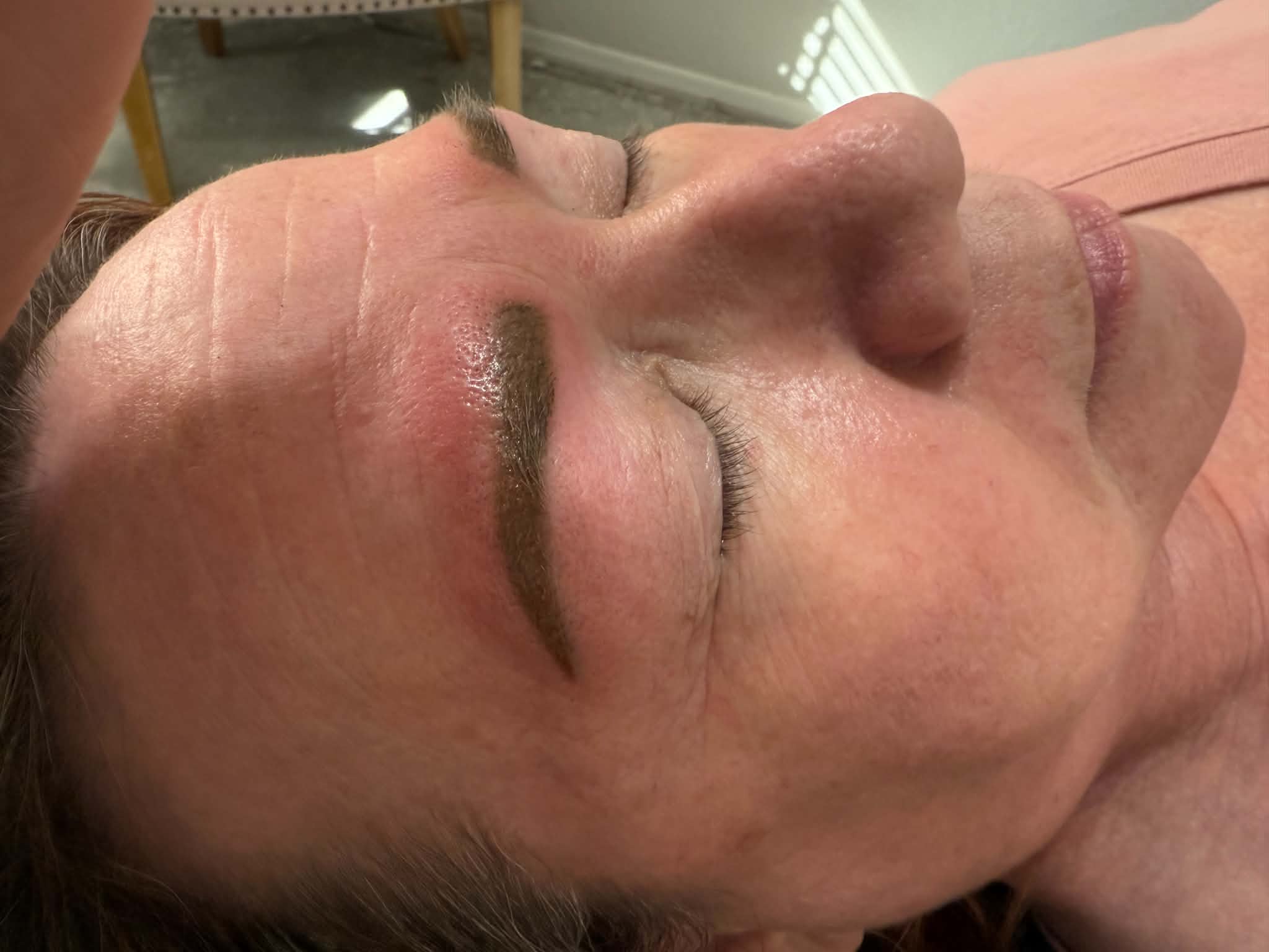 Detail of a freshly shaped and colored brow